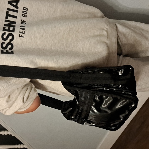 LeSportsac Deluxe Everyday Bag in a black shine or patent finish. - Picture 2 of 13